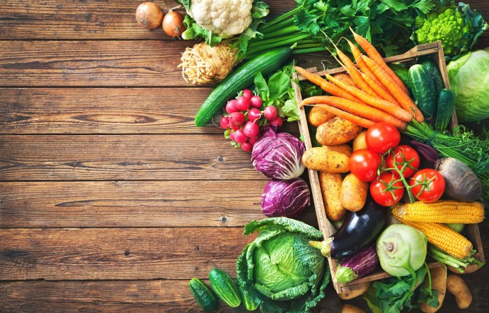 Fruits and vegetables on a wooden background