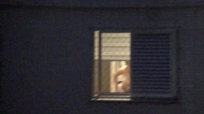 Naked on the balcony spied
