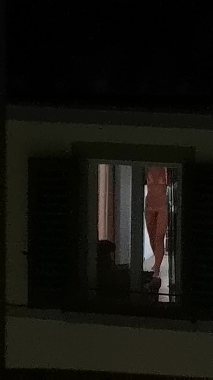 Naked in the windows of neighboring houses