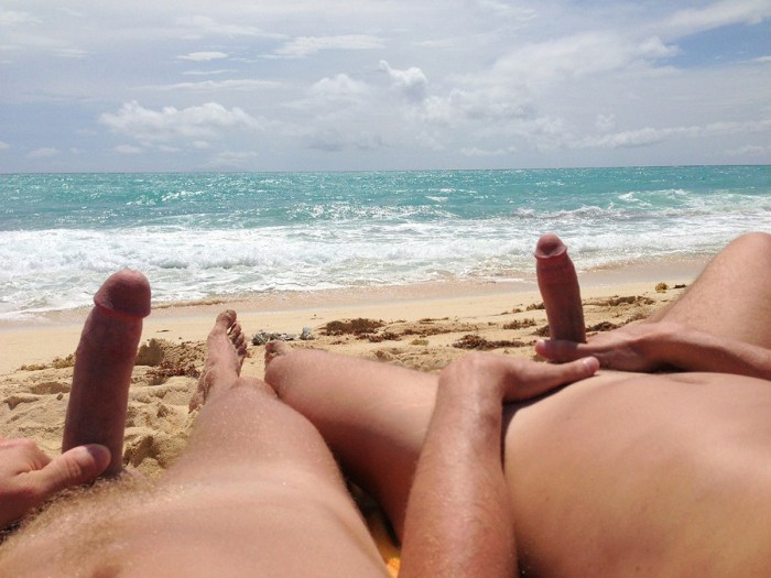 Muscular naked guy on the beach