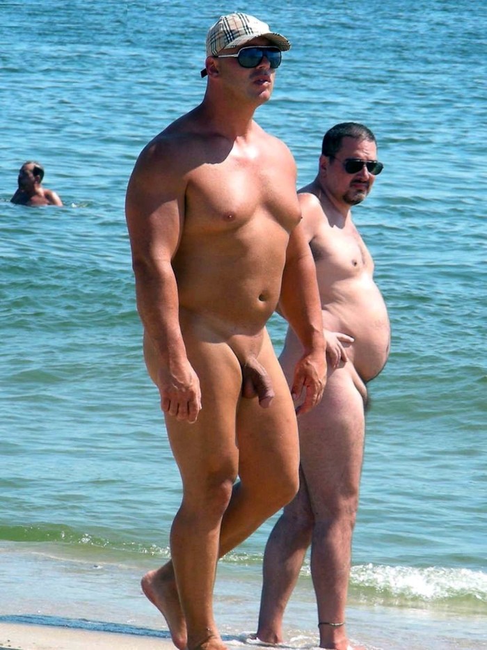 Naked men and women on the beach