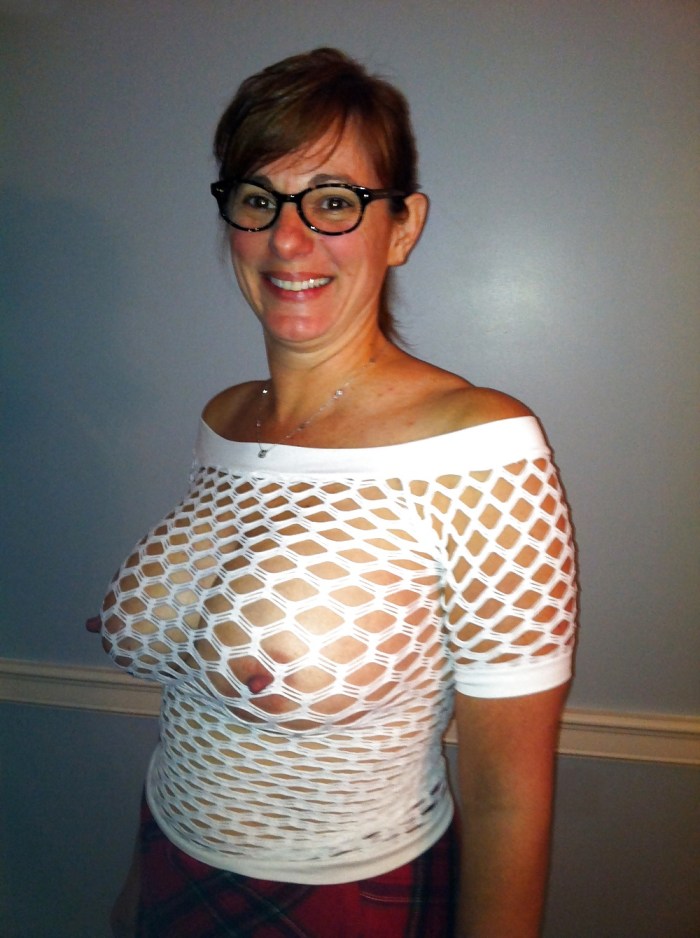 Big breasts under a transparent blouse