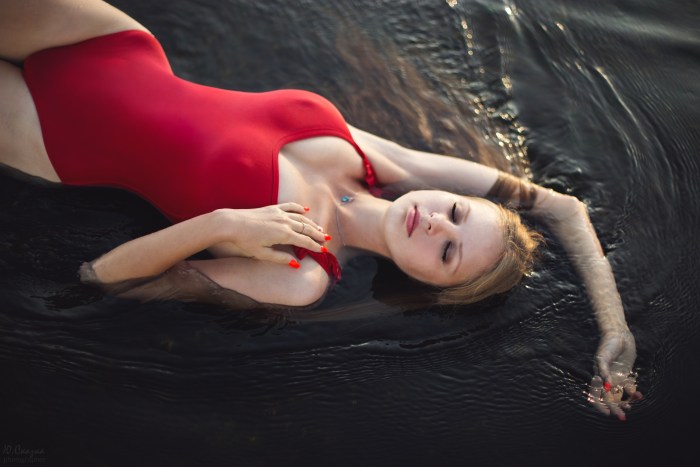 Girl lies in water