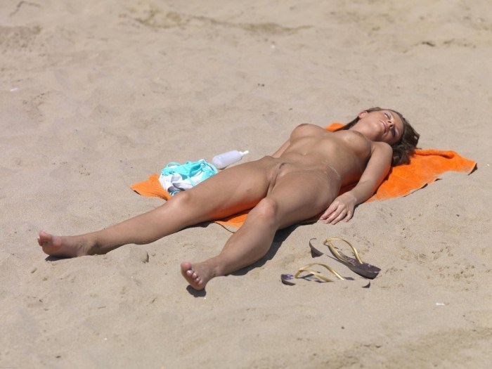 Adult naked women sunbathe