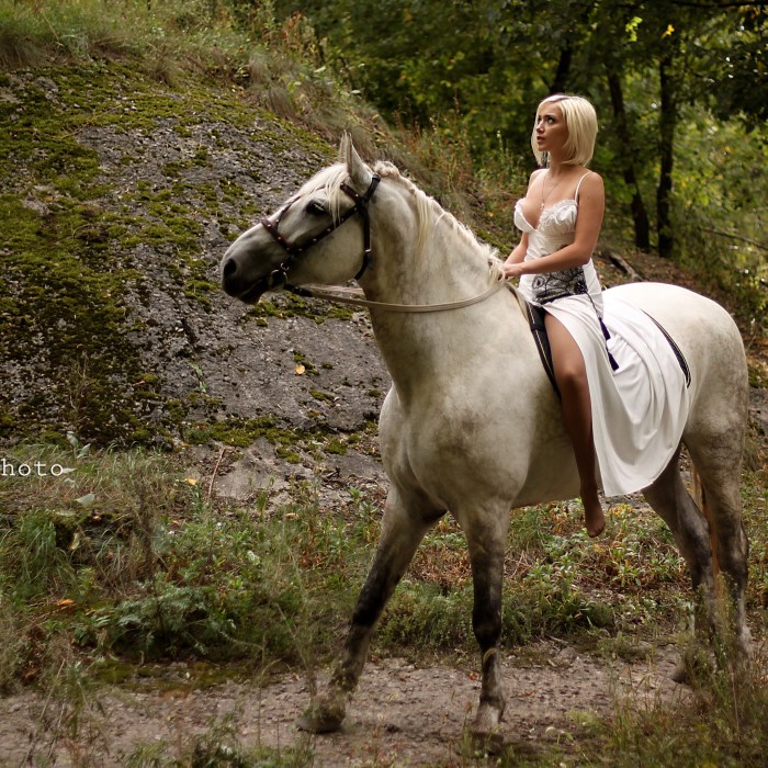 Naked busty girl and horse
