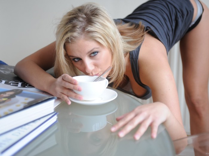 The blonde drinks coffee