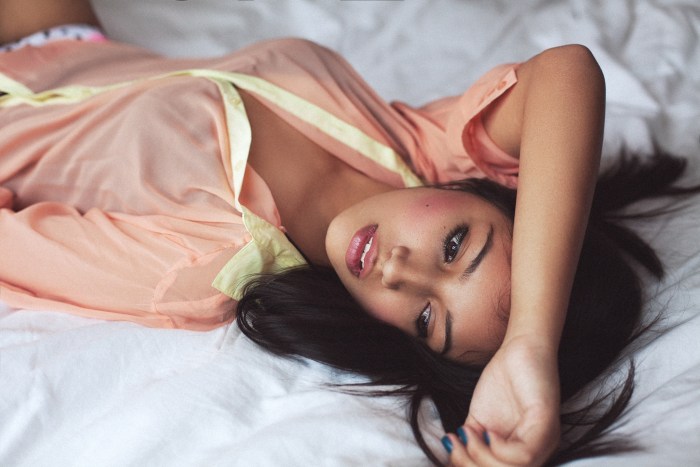 Girl in a shirt lies