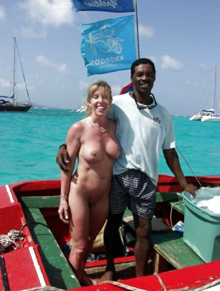 Naked mature and black man on the beach