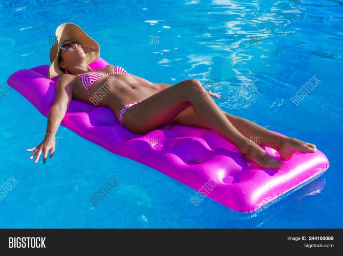 Tanned girl on an inflatable mattress