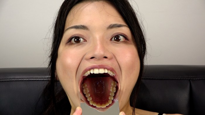 Opened her mouth stuck out her tongue