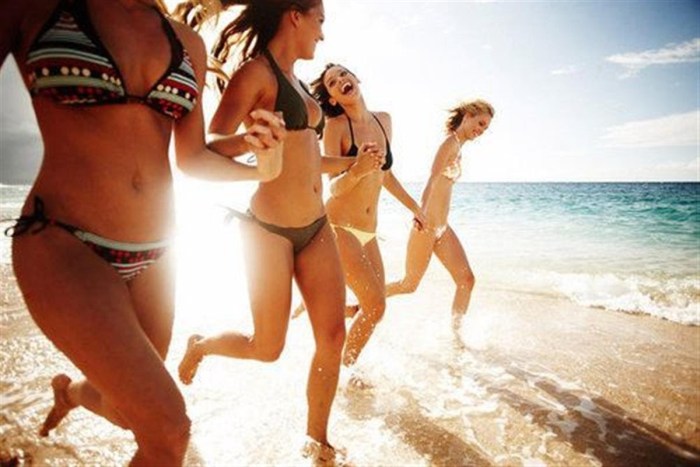 Girls on the beach without swimming trunks