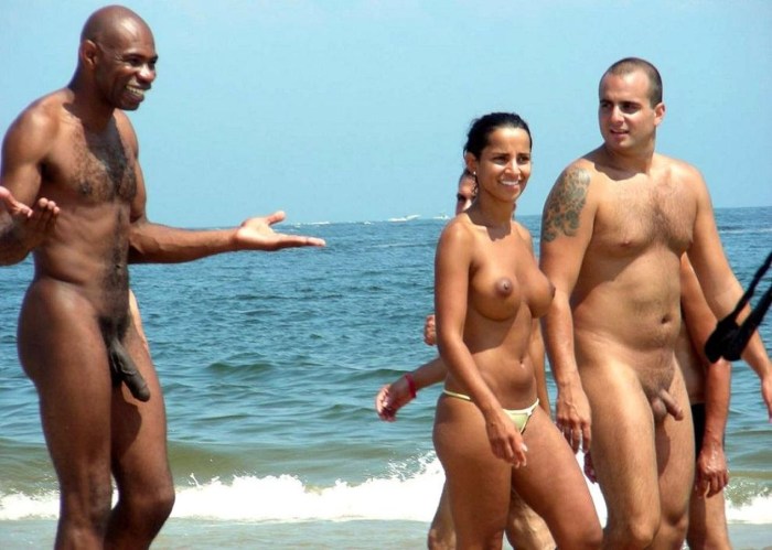 A guy with a huge member on the beach