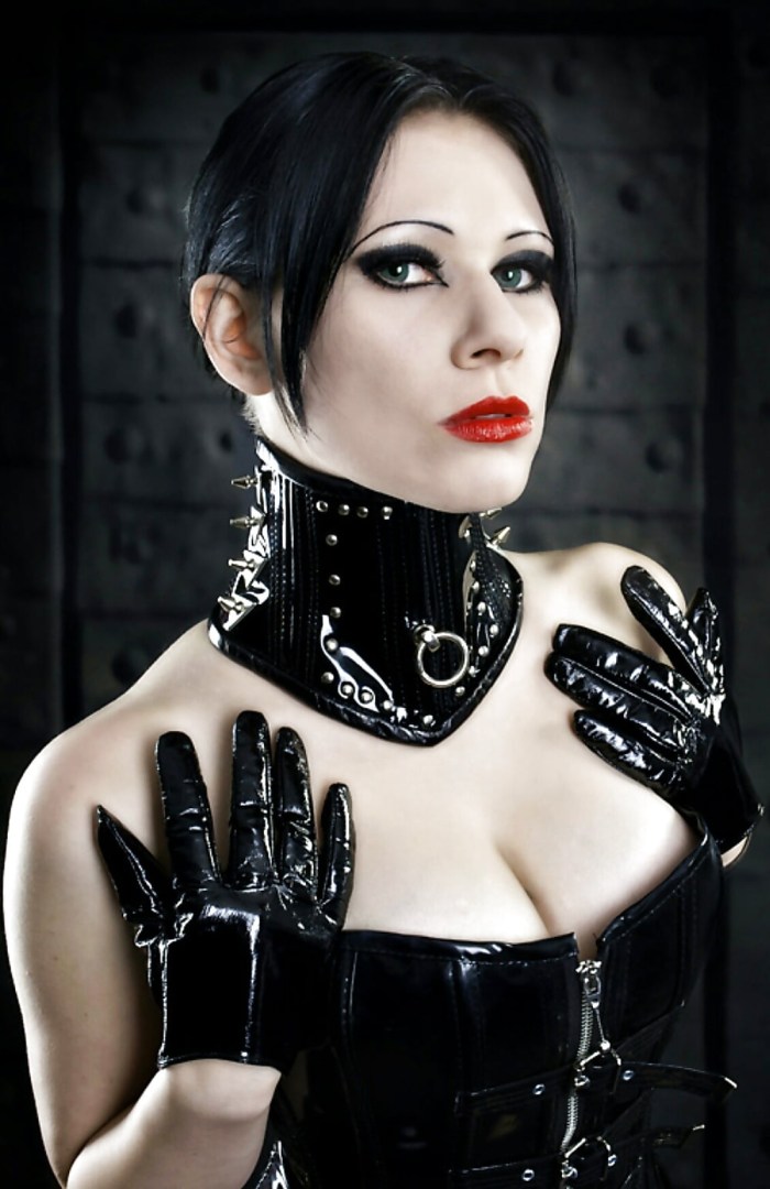 Girl in a corset with open breasts