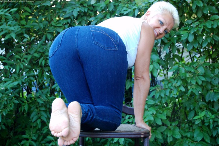Naked old woman hangs underwear