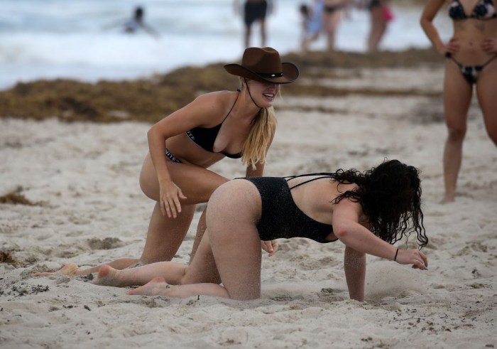 Trans on the beach in a swimsuit
