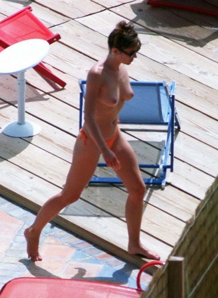 Elizabeth Hurli on the yacht topless