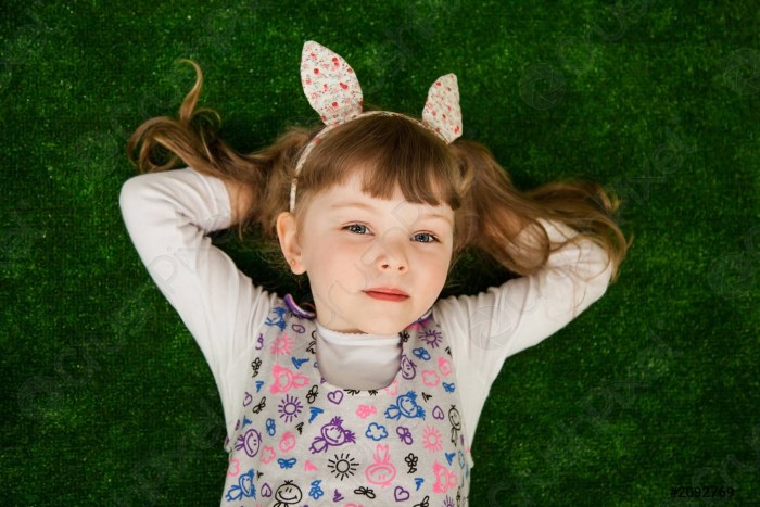 Girl on the pillow smiles at Shutterstock