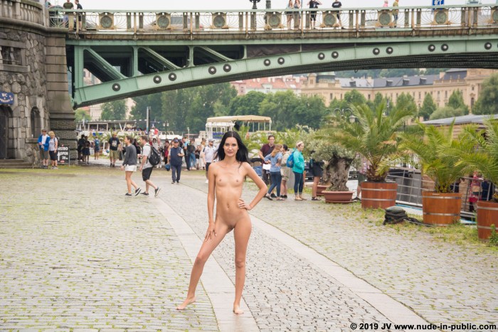 The girl undresses in public