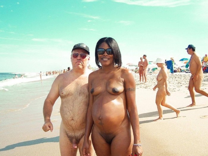 Naked men and women on the beach