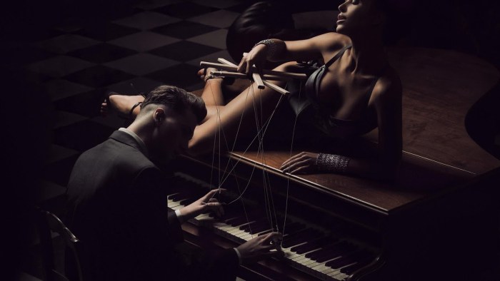 Woman lies on the piano