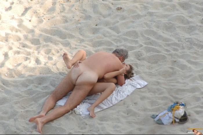 Naked men and women on the beach
