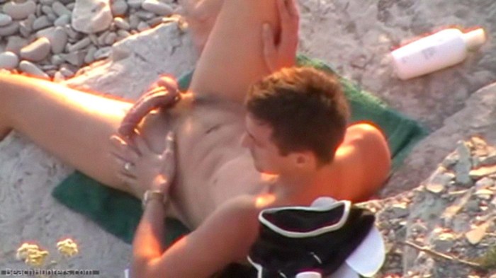 Joint masturbation on the beach