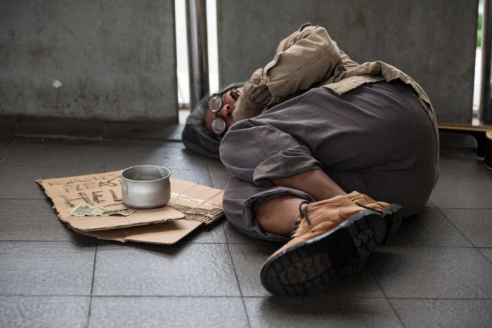 The girl is lying on the street