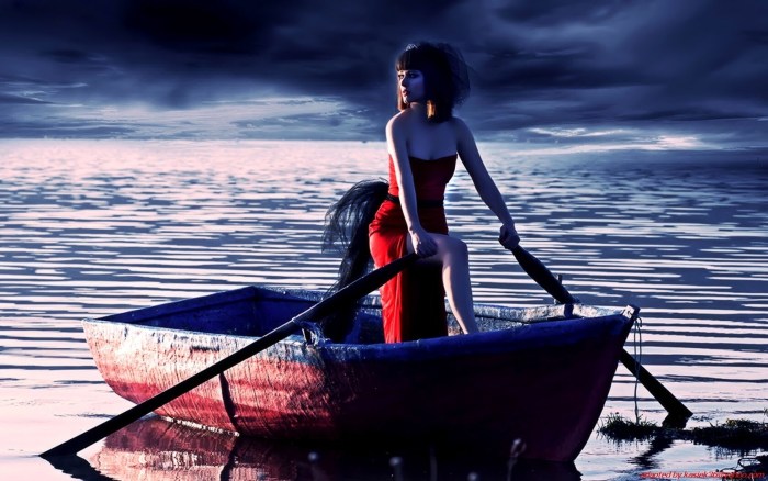 The girl is swimming in a boat