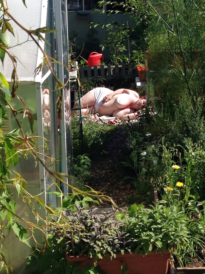 Adult naked women sunbathe