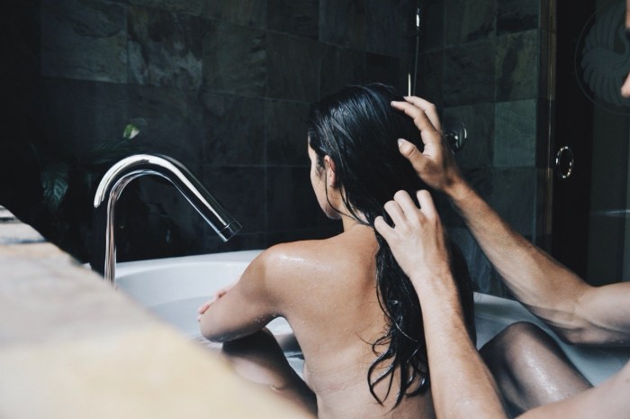 A guy with a girl in a bath