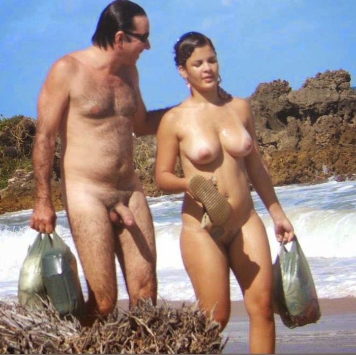 Naked men and women on the beach