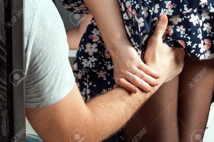 A man touches a woman