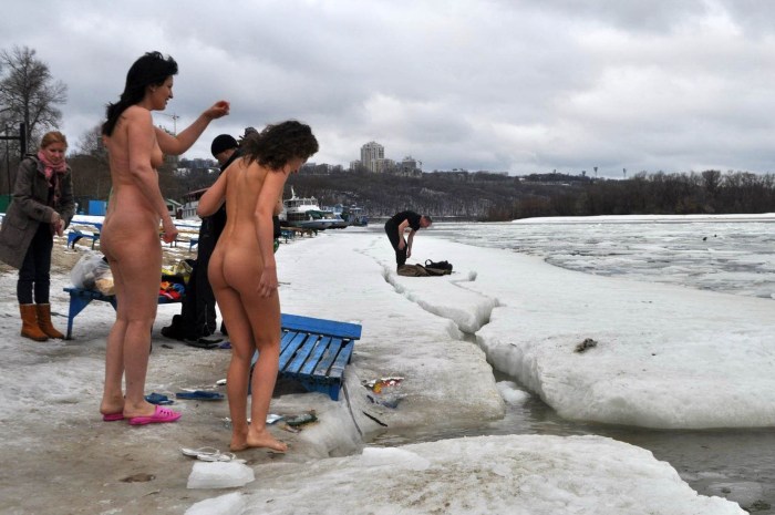 Naked women bathe in the hole