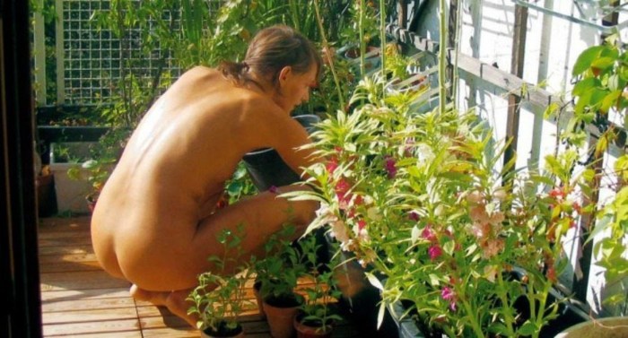 Naked women in a greenhouse