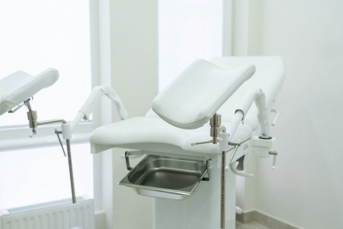 An elderly woman by a gynecologist