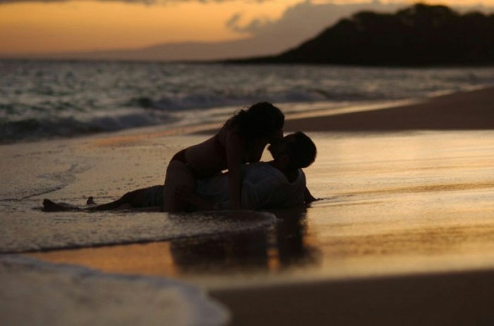 A couple at sea at night