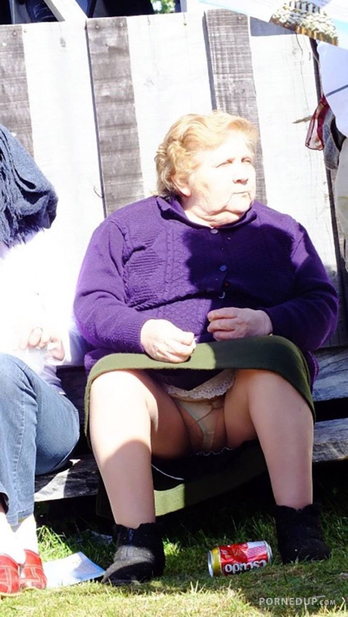 Old woman in a skirt without panties