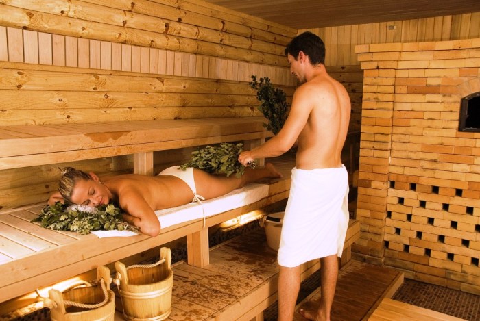 Massage with a broom in a steam room
