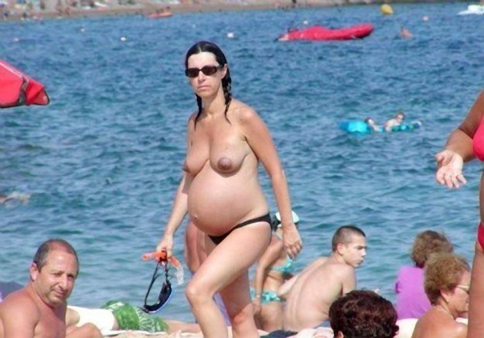 Naked pregnant woman on the beach big