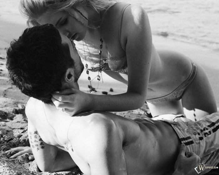 Passionate kiss in bed