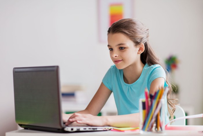Photo as a girl makes homework