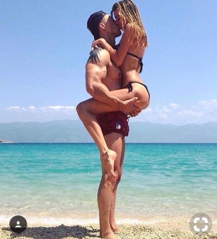 Naked beautiful young couples at sea
