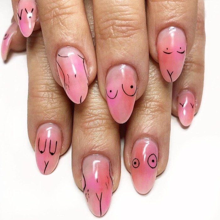 Bright manicure with inscriptions