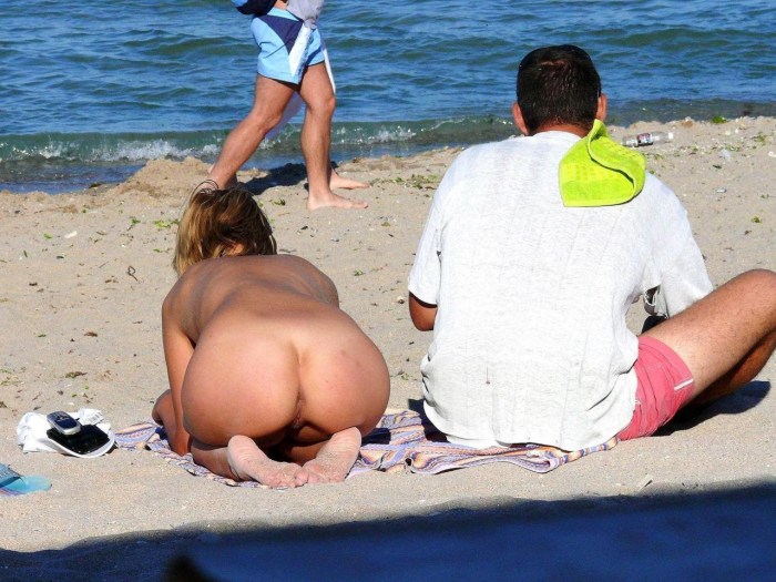Without panties on a public beach