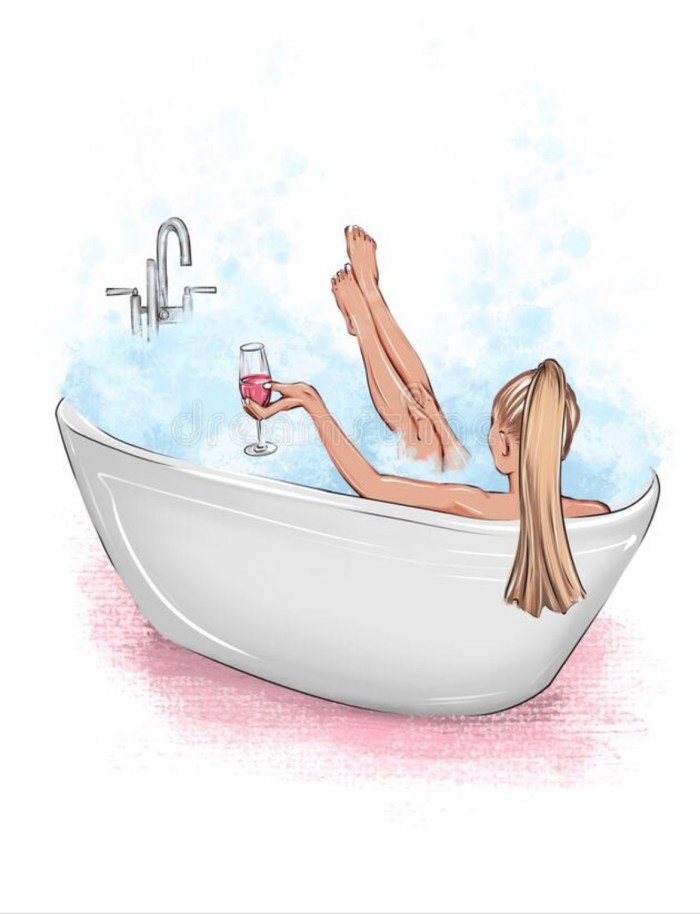 Girl in a bath with a glass of wine