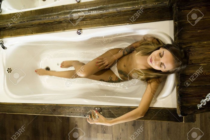 Girl in a jacuzzi with foam