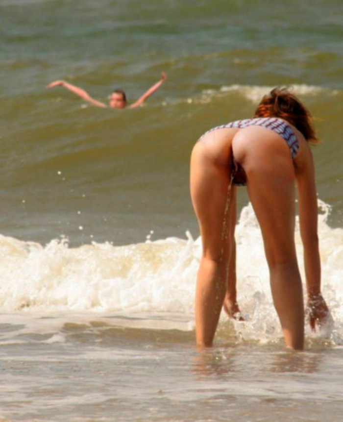 Girls on the beach with a racer hidden