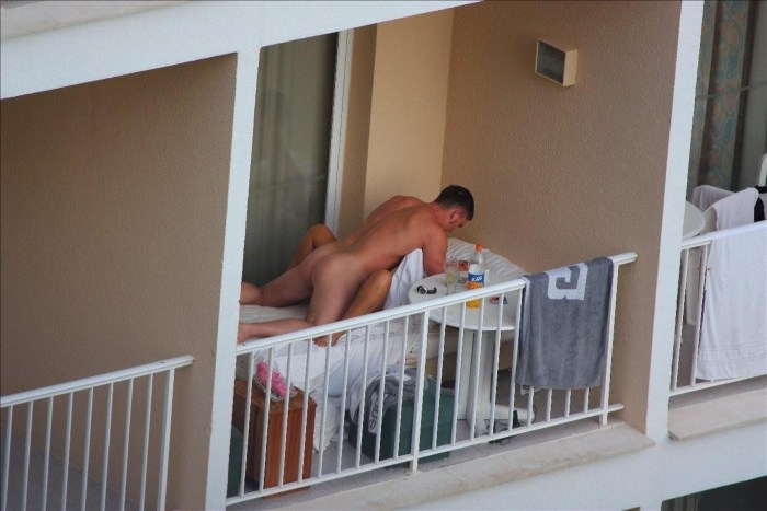 Peeping out the windows behind the naked