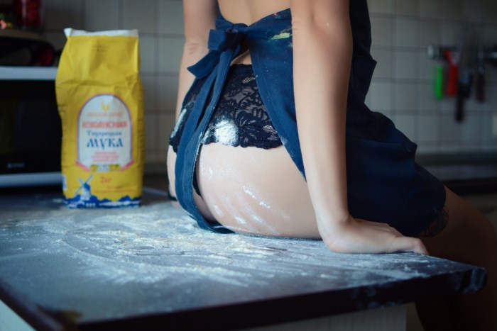 Girl in apron with flour