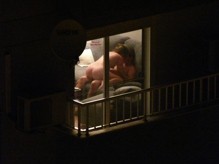 Naked woman through the window